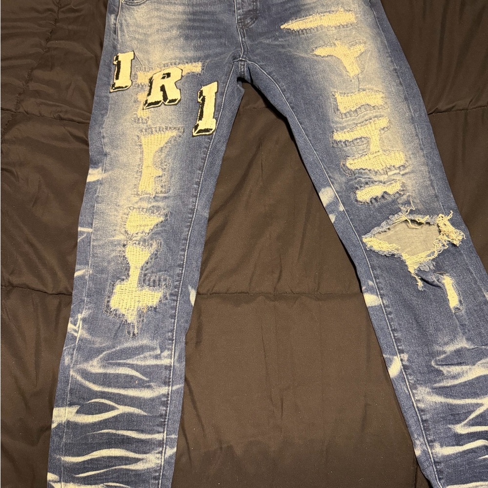 AMIRI Blue Distressed Skinny Jeans